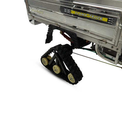 Llama Truck rear axle with rubber tracks installed for mud and snow.